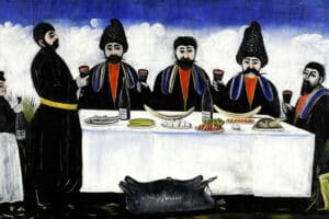 Fresque de cinq Géorgiens assis à une table avec un verre dans les mains