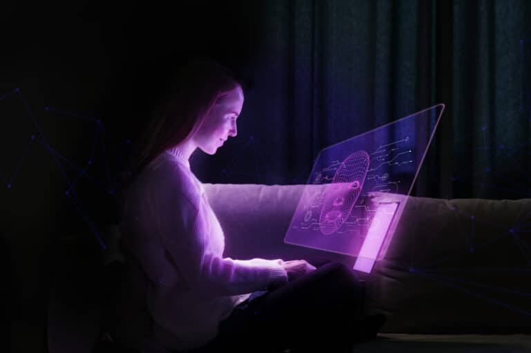Une silhouette qui utilise un ordinateur portable